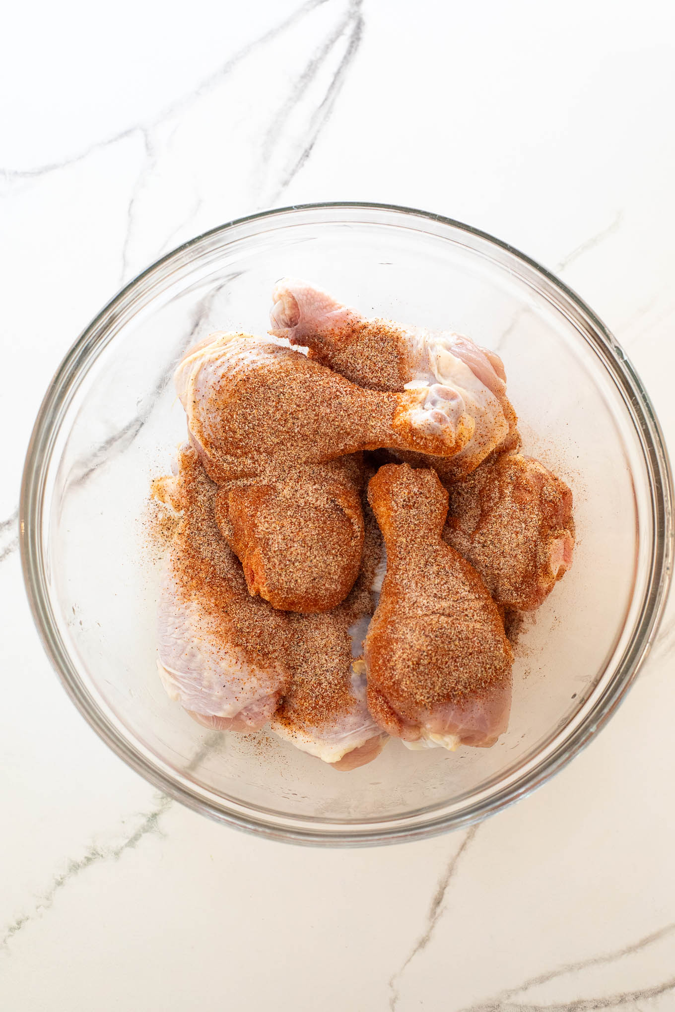 chicken legs covered with dry spice rub.