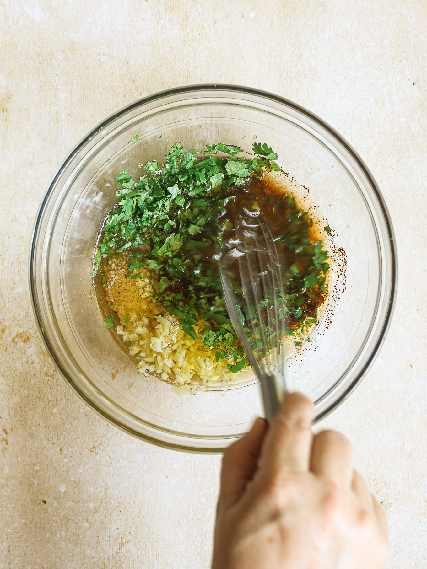 chicken marinade ingredients in a glass bowl.