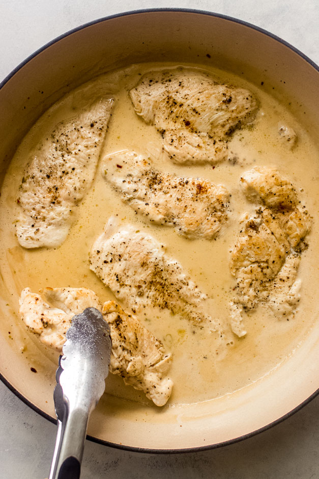 chicken breast inside creamy sauce.