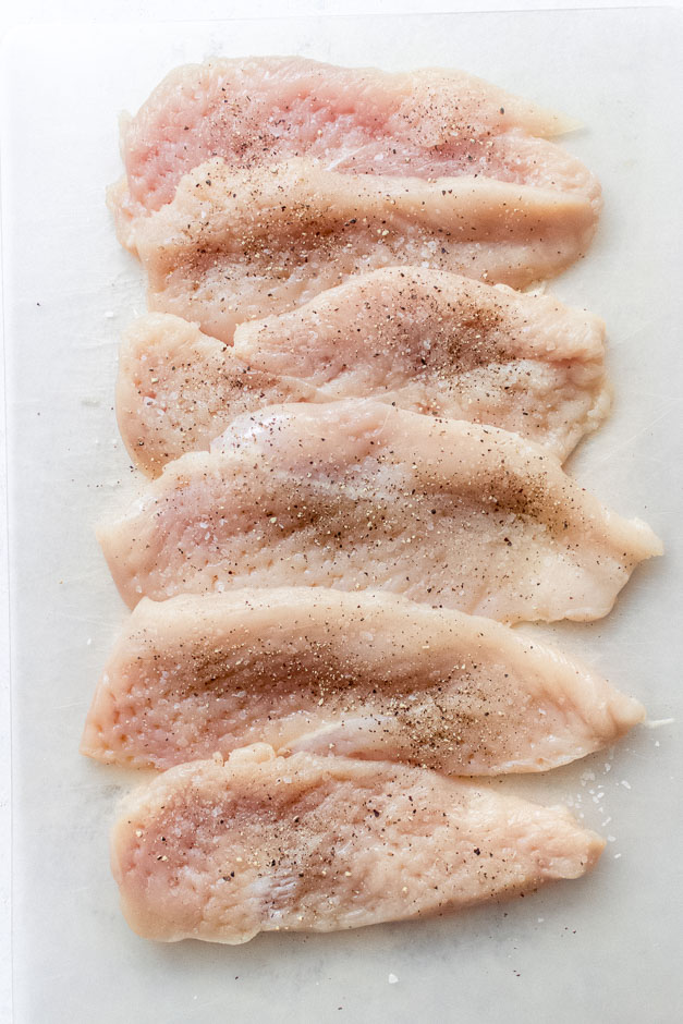 chicken breast seasoned with salt and pepper.