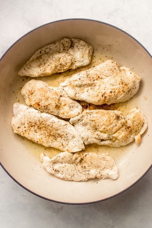 seared chicken breast inside a pan.