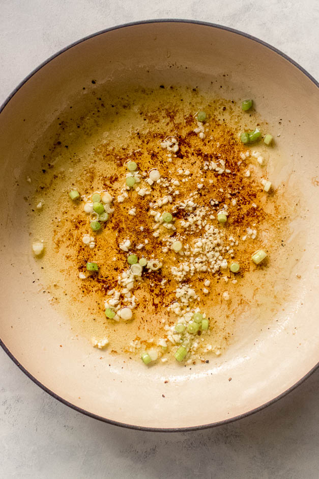 cooked garlic with onions inside a pan.