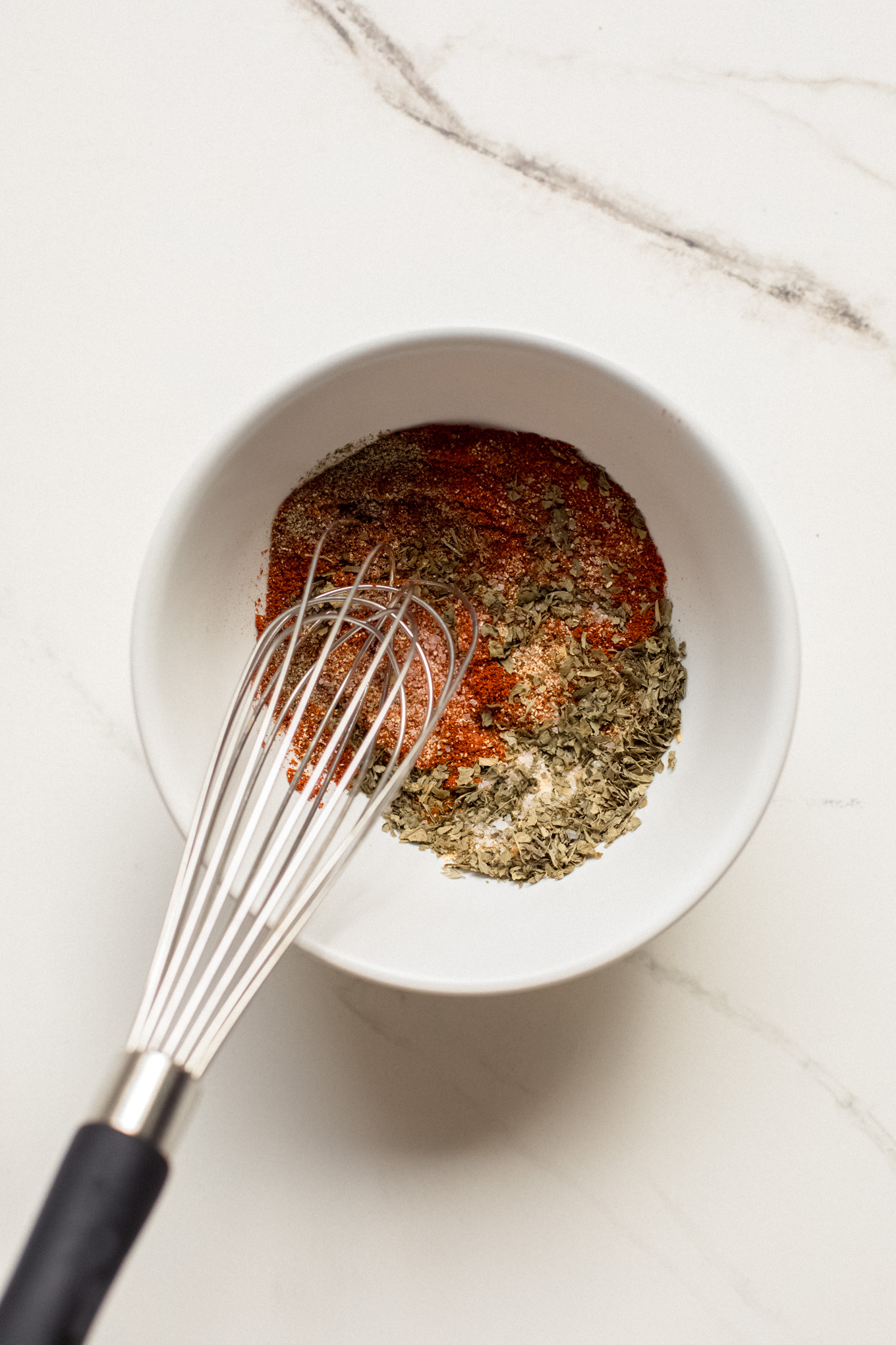 spices whisked in a bowl.