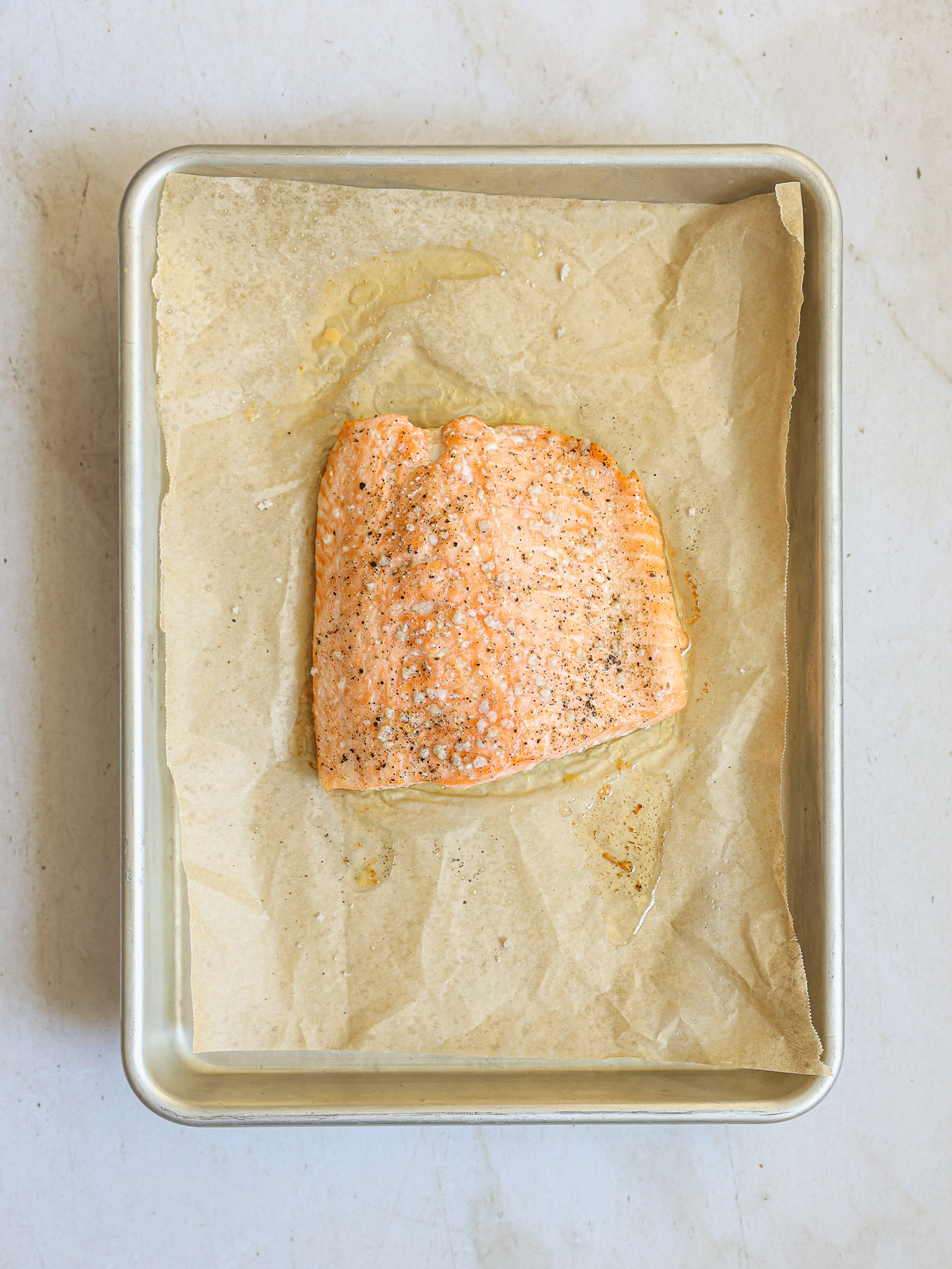 baked salmon on baking sheet.