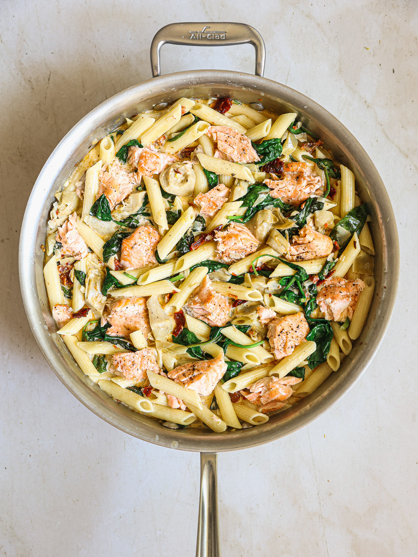 salmon with cooked pasta and cream sauce.