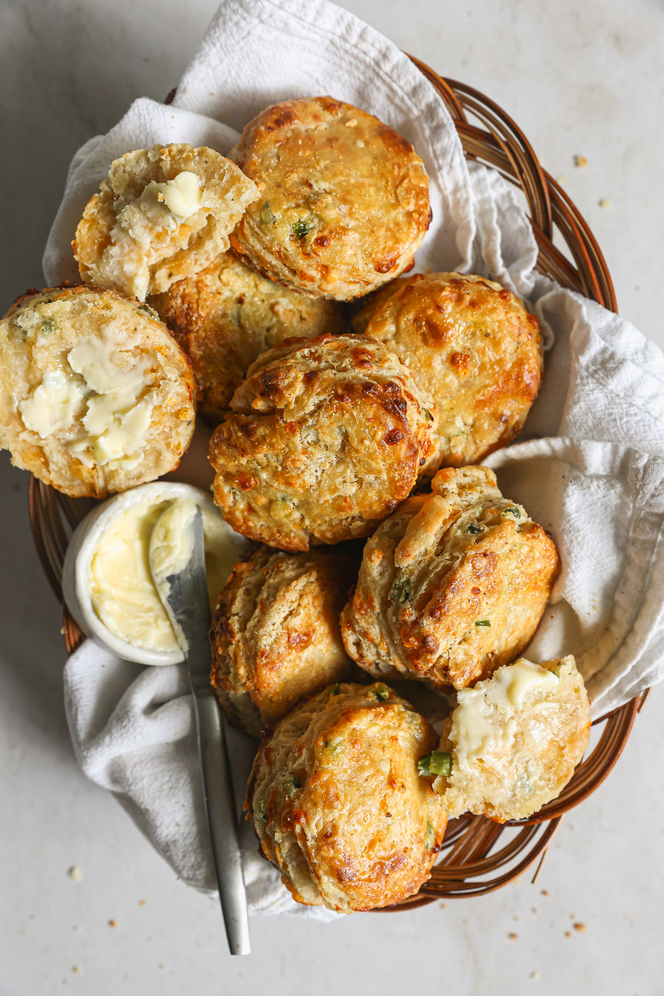 cheddar jalapeno biscuits in a basket.