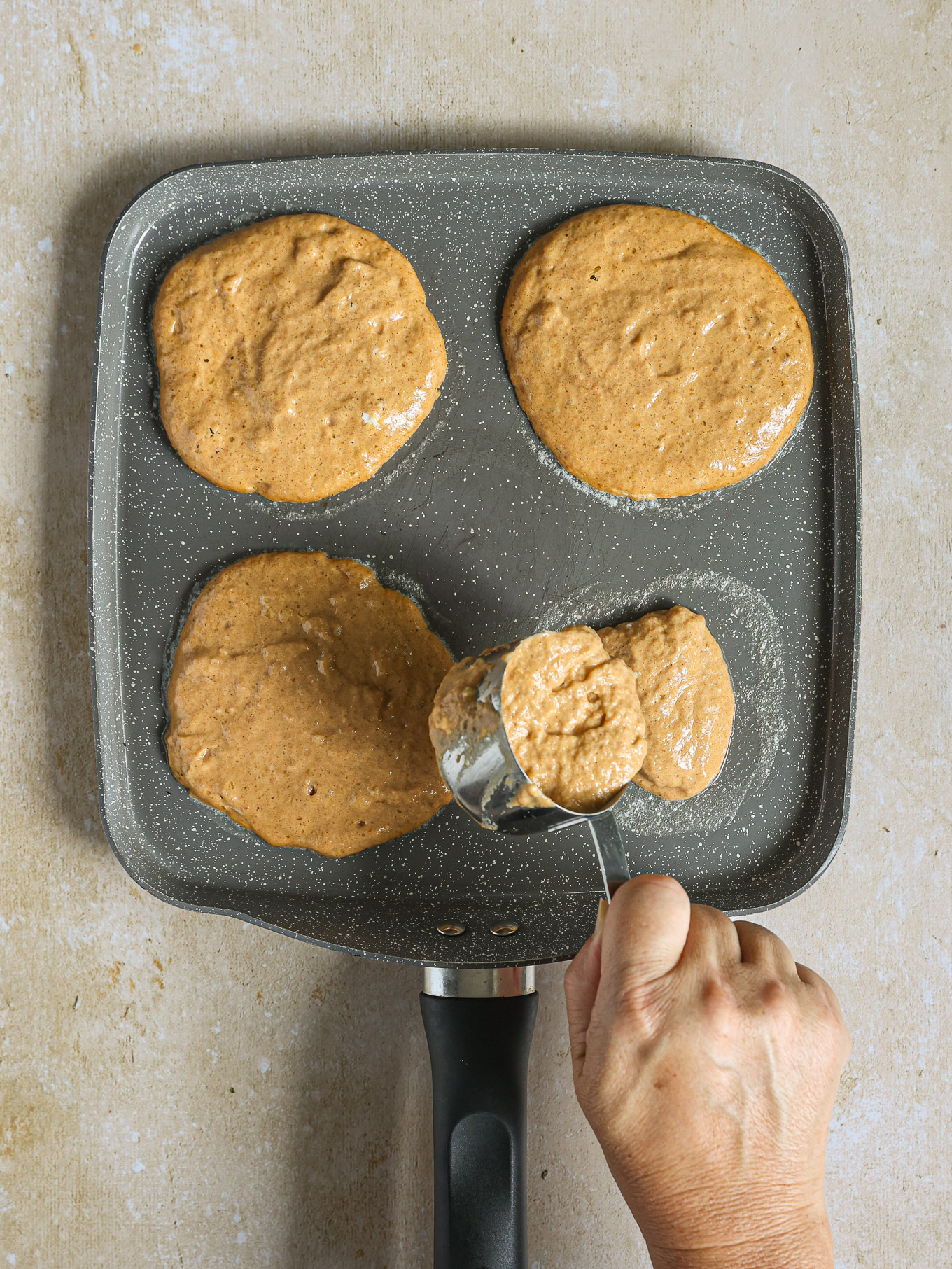 pumpkin pancakes on a griddle.